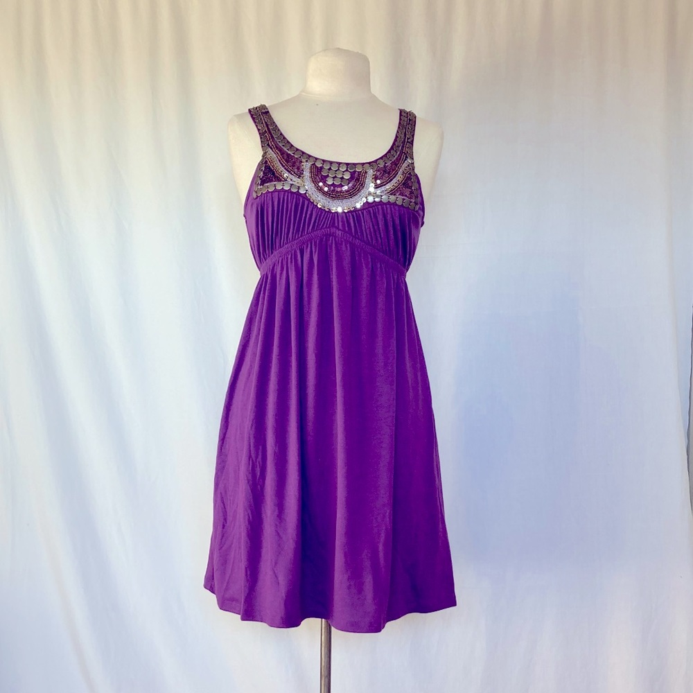 Purple knit dress with sequined trim.